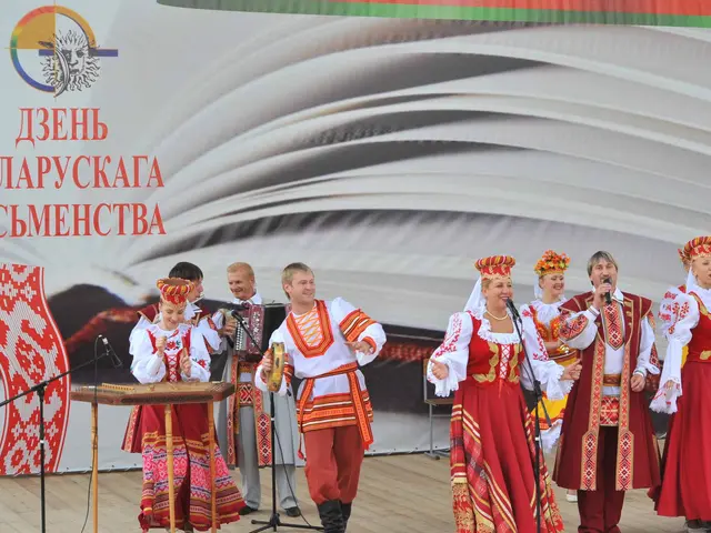 The image shows a group of people in red and white outfits standing on a stage, singing and playing...