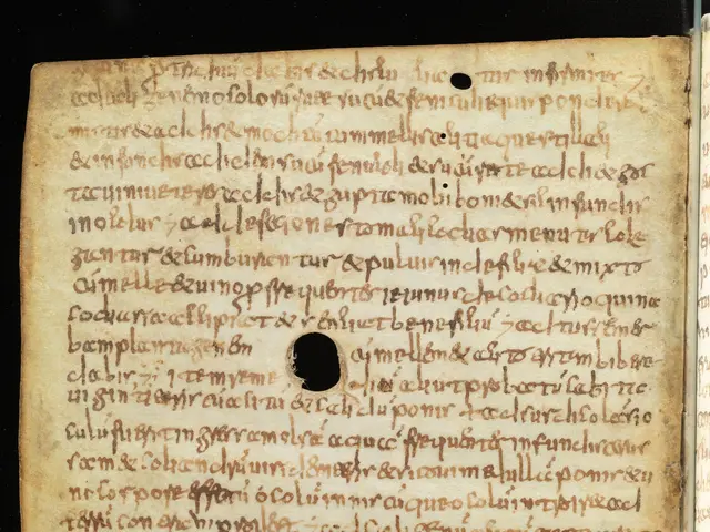 The image shows an open book with a hole in the middle of it, which appears to be a page from a...