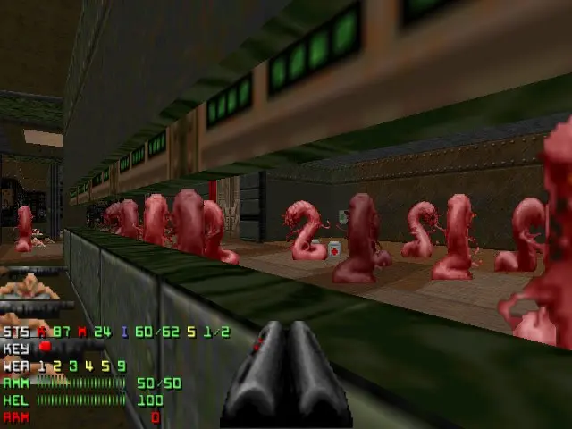 The image shows a screenshot of a video game with a bunch of zombies in a room, with a gun at the...