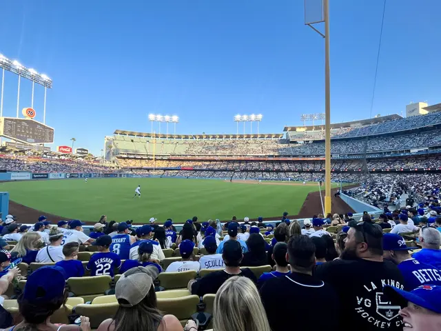 The image shows a baseball game being played in Dodger Stadium, home of the Los Angeles Dodgers....