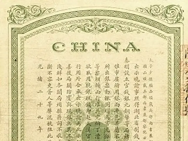 The image shows an old Chinese banknote with Chinese writing on it. The paper has text written on...