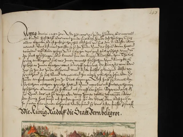 The image shows an open book with a drawing of a city on it, set against a dark background. The...