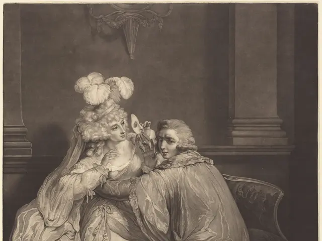 The image shows a man and a woman sitting on a couch, with the man holding a mask in his hand. At...