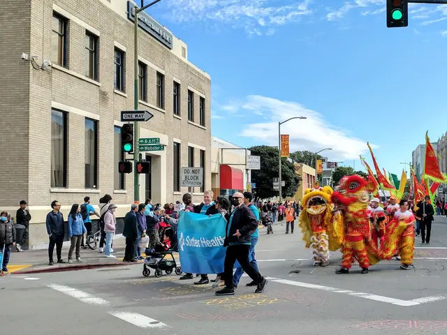The image shows a group of people walking down a street in San Francisco during the Chinese New...