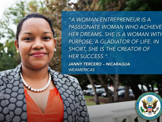 The image shows a woman entrepreneur wearing a black and white jacket and an orange dress, standing...
