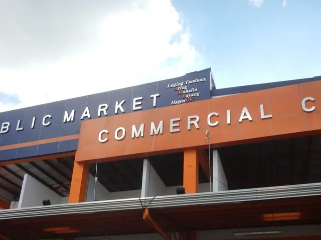 The image shows a public market commercial center with people walking in front of it. The building...