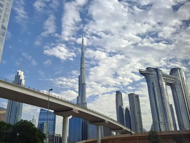 The image shows the iconic Burj Khalifa in Dubai, United Arab Emirates, surrounded by skyscrapers,...
