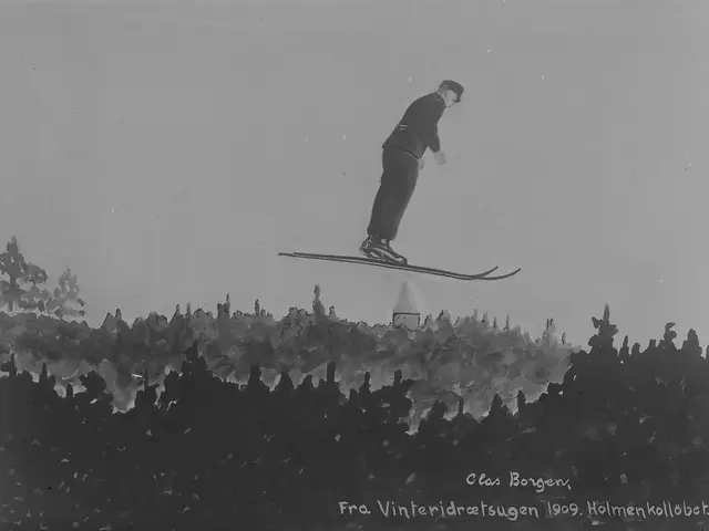 The image shows a man on skis in the air over a hill, with trees in the background and text at the...