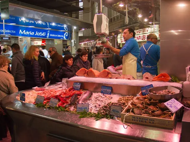 This picture might be taken in a market, in this picture at the bottom there are some fishes and...