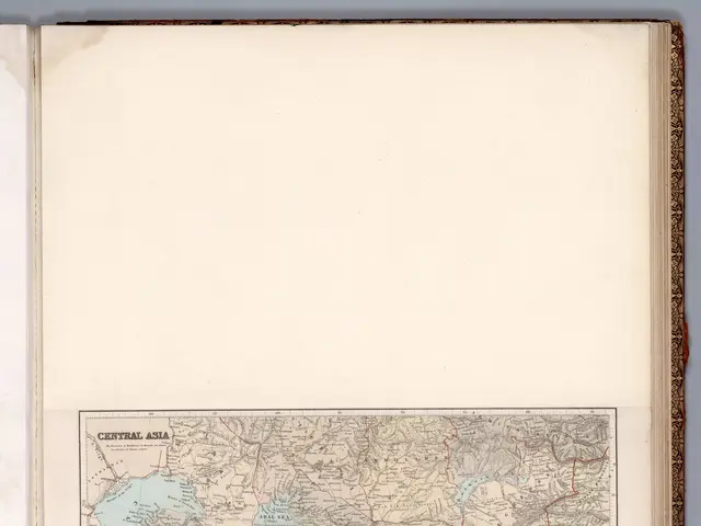 The image shows an open book with a map of Central Asia on it. The map is detailed and shows the...