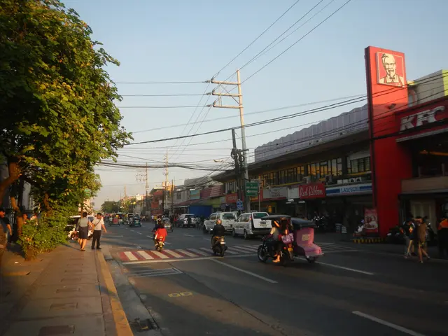 The image shows a bustling city street in Ho Chi Minh City, Vietnam, with vehicles and people on...