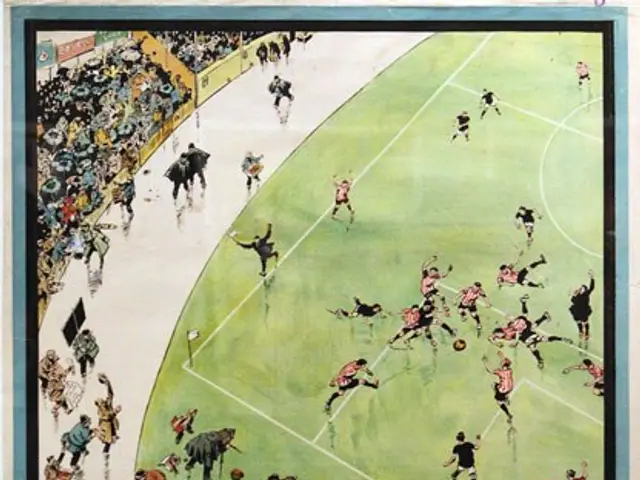 The image shows a poster on the wall depicting a group of people playing football in a stadium,...