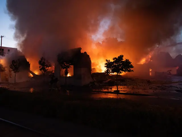 The image shows a massive blaze ripping through an east windsor plaza on April 9, 2012. We can see...