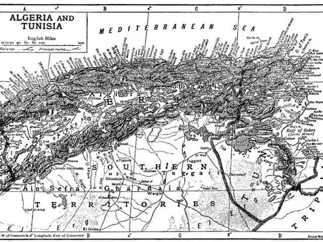 The image shows a black and white map of Algeria and Tunisia, with text written on it. The map is...
