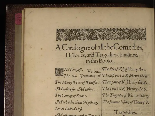 The image shows an open book with text on it against a dark background. The book appears to be a...