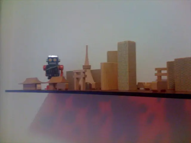 In this image there are toys on the shelf.