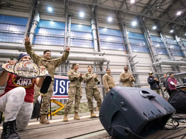 The image shows a group of people standing on top of a stage, with a woman in a squat position...