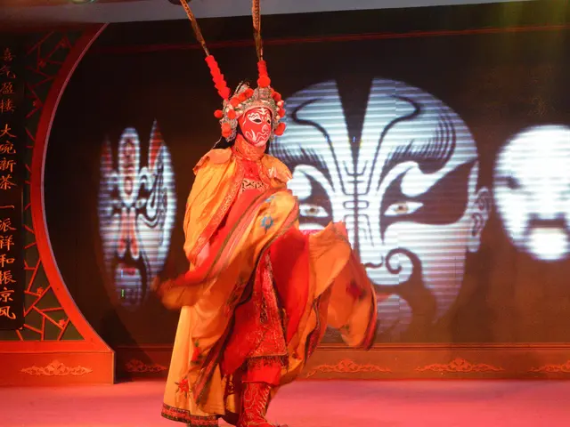 The image shows a person wearing a costume and a mask, performing a Chinese opera on a stage with a...