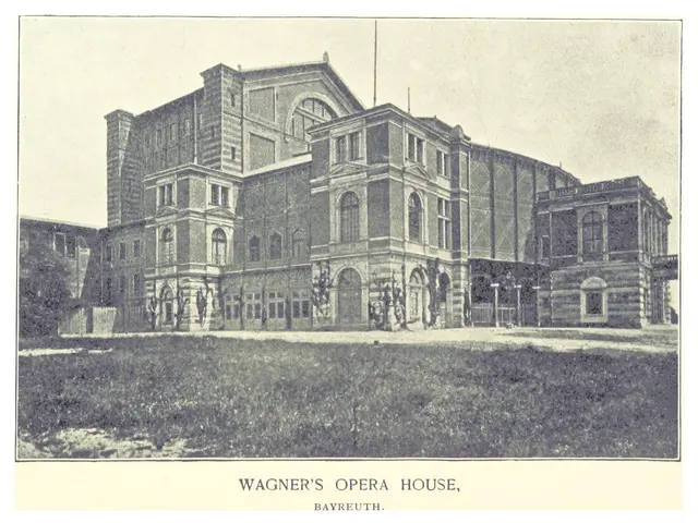 The image shows a black and white photo of Wagner's Opera House in Bayreuth, with a few people...