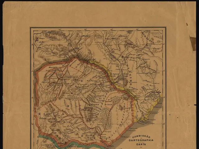 The image shows an old map of the provinces of Colombia on a piece of paper with a black...