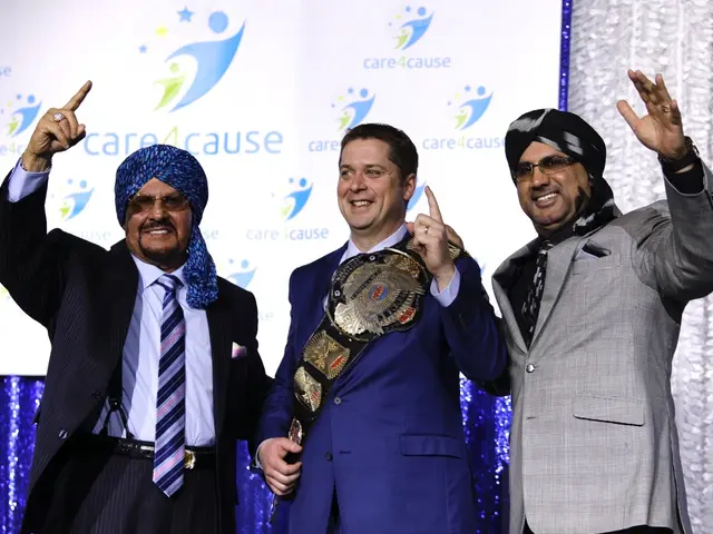 The image shows three men standing next to each other on a stage, with one of them holding a belt....