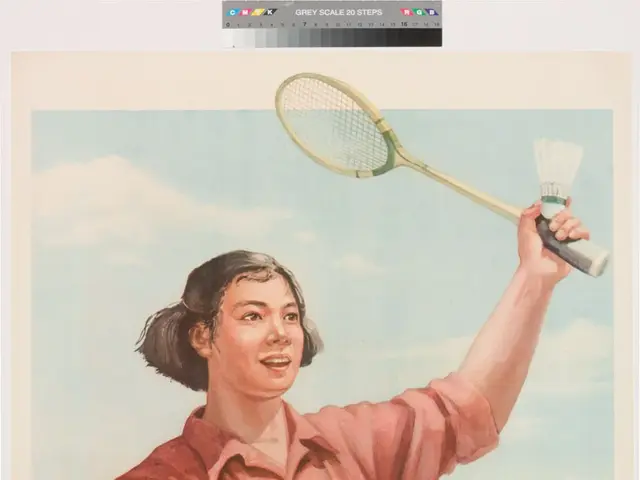 The image shows a woman holding a badminton racket in her hand, surrounded by a group of people,...