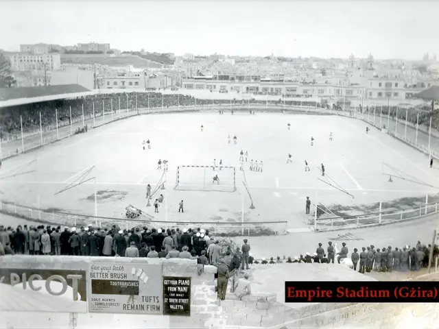 The image shows an old black and white photo of Empire Stadium in Giza, with a group of people...
