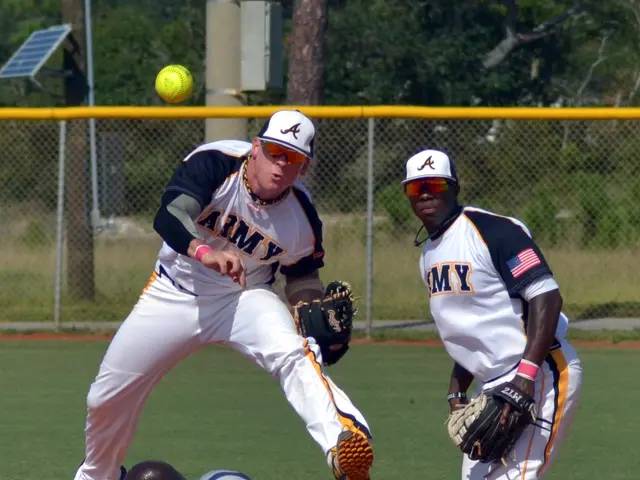 The image shows a baseball player sliding into home plate during a game. The player is wearing a...