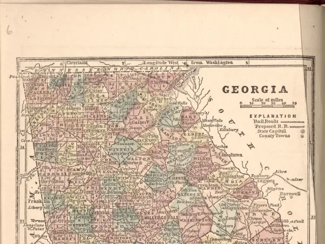 The image shows an old book with a map of Georgia on it. The map is detailed and shows the various...