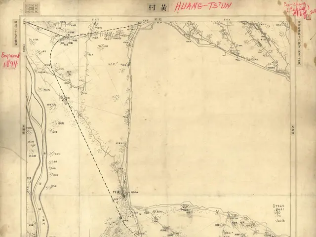 The image shows an old map of the city of Hong Kong on a piece of paper. The map is detailed and...
