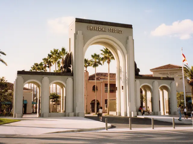 The image shows the entrance to Universal Studios Hollywood in Los Angeles, California. It features...