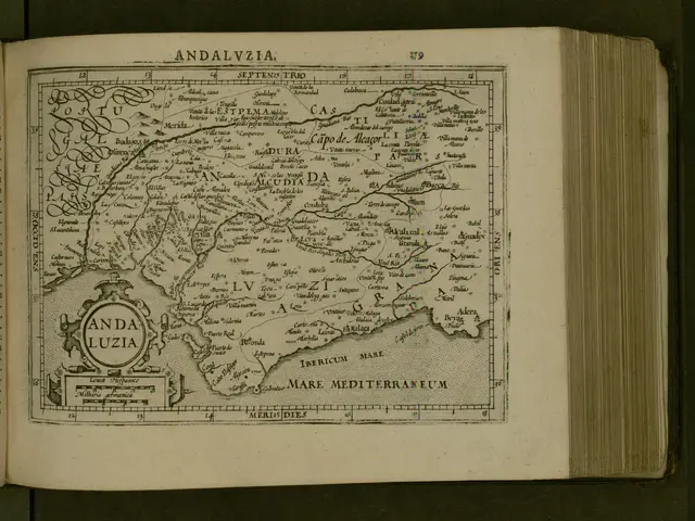 The image shows an open book with a map of Andalucia on it. The map is detailed and shows the...
