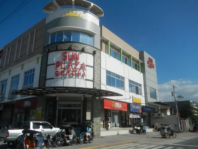 The image shows the Sun Plaza Gerona in Cebu City, Philippines. It features buildings, motor...