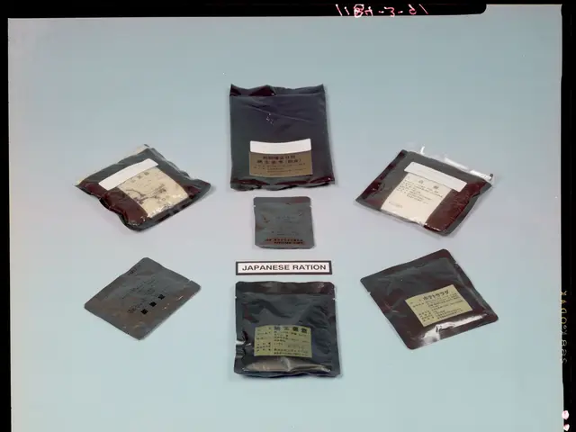 The image shows a group of six packets of Japanese ration sitting on top of a table. The packets...