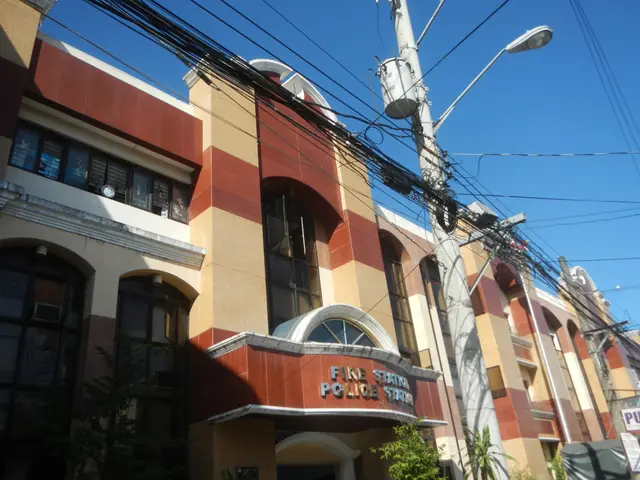 The image shows a fire station in Manila, Philippines, with buildings, street poles, street lights,...