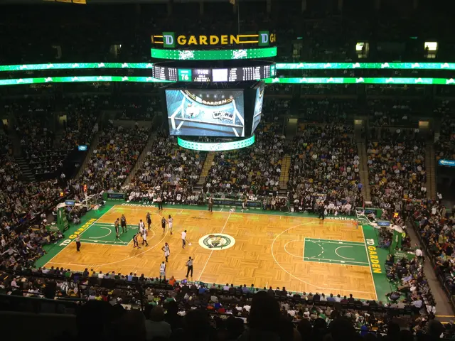 The image shows a basketball game being played in a large arena, TD Garden, home of the Boston...