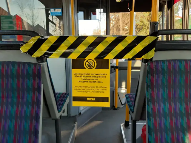 The image shows the inside of a bus with a yellow and black caution tape on it. Inside the bus,...