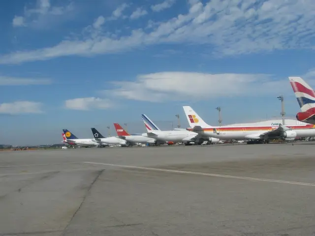 In this image there are few flights on the runway, there are few poles and cables and some clouds...