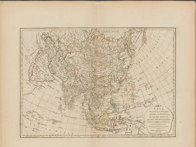 The image shows an open book with a map of Asia on it. The map is detailed and shows the various...