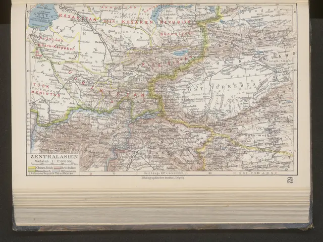 The image shows an old book with a map of the Caucasus region on it, set against a black...