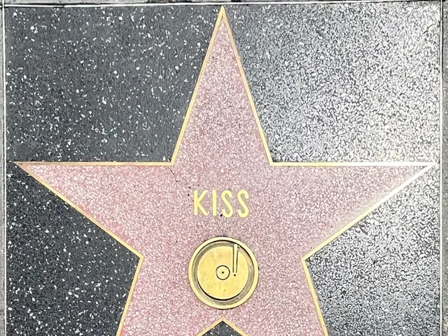 The image shows a star on the Hollywood Walk of Fame with the word "Kiss" inscribed on it.