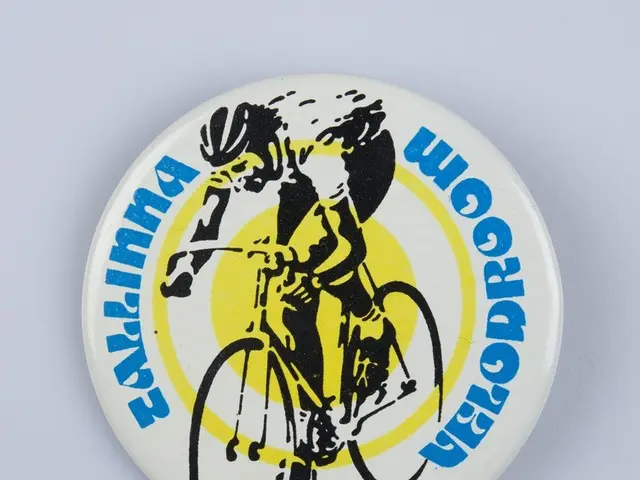 The image shows a white badge with a picture of a man riding a bicycle on it, with the words...