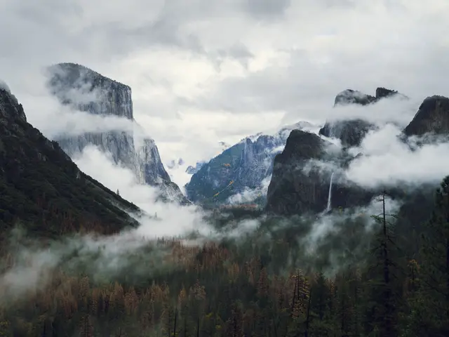 The image shows a stunning view of Yosemite National Park in California, USA, with lush green...
