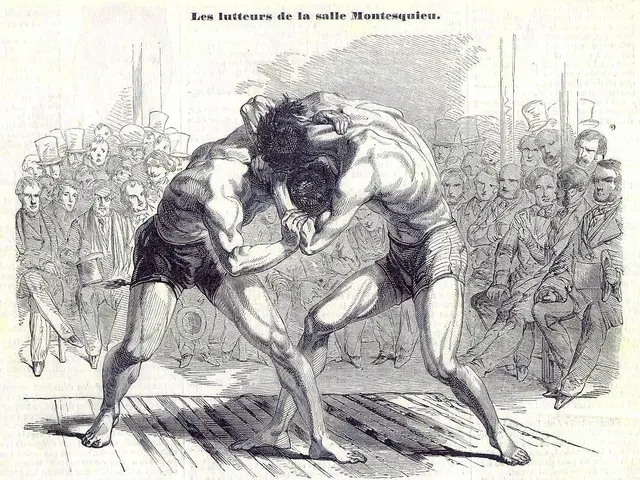 The image shows two men wrestling in front of a crowd of people, with text at the top and bottom of...