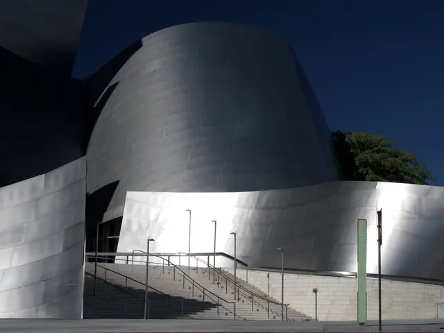 The image shows the ARTIST Concert Hall in Los Angeles, California. It is a large building with a...
