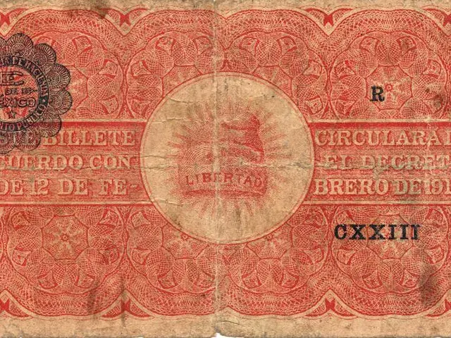 The image shows an old Mexican banknote from 1914 with a red and black design on it. The note is a...