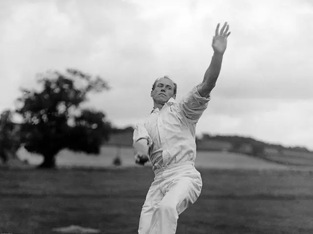 The image shows a man in a white shirt and pants playing a game of cricket, with a wicket on the...