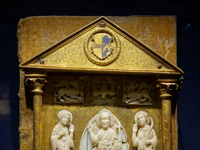 The image shows a gold plaque with carvings on it in a dark room, depicting a reliquary. The plaque...