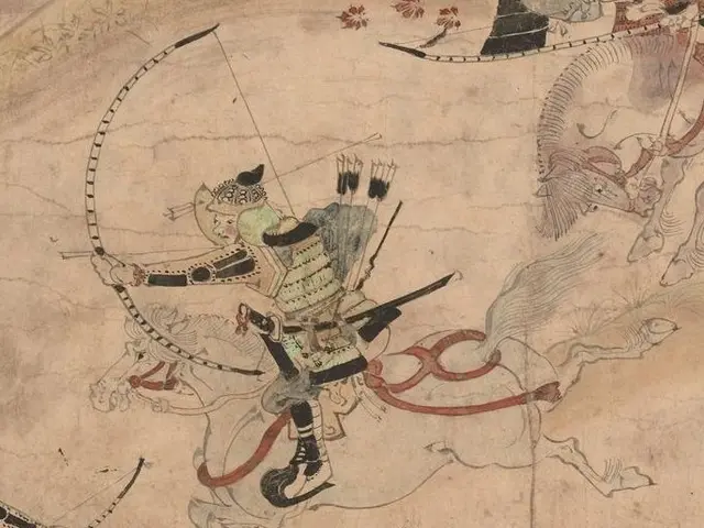 The image shows a painting of a samurai on horseback, holding a bow and arrow, with a few other...