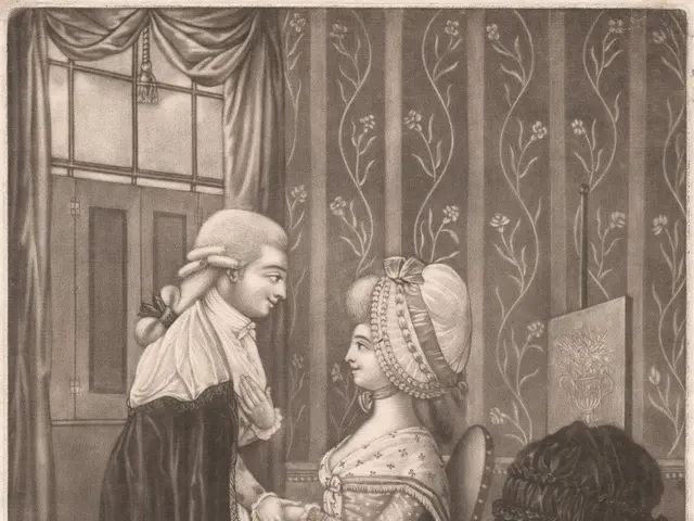 The image shows a man and a woman sitting at a table, with the man holding the woman's hand. On the...